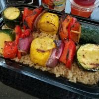 Vegetable Bento DOUBLE · Daily cut and marinated zucchini, squash, and red onion skewers atop a fluffy bed of white o...