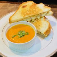 Tomato Soup & Grilled Cheese Combo (Cup Soup/Half Sandwich) · A cup of our homemade tomato basil bisque with a whole panini grilled three cheese grilled c...