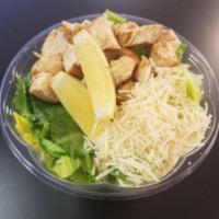 Chicken Caesar · House roasted chicken, romaine lettuce, parmesan, and a lemon wedge. Caesar dressing on the ...