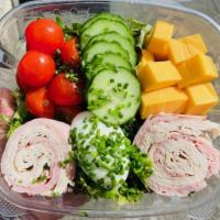 Chef Salad · Mixed greens, ham, turkey, tomato, cucumber, cheddar cheese, and hard boiled egg garnished w...