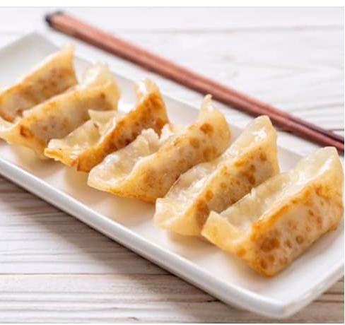 Pan Fried Dumplings 鸡肉煎饺 · 7 pieces.