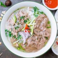 P2 Rare Eye Round Pho Noodle Soup 生牛肉河粉 · with beef broth soup