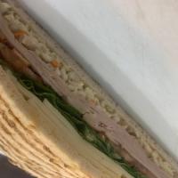 P7. Delightful Panini · Honey maple turkey, provolone cheese, coleslaw, lettuce, tomatoes and mustard.