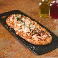 BBQ Chicken Flatbread · BBQ chicken, red onion, cheddar, mozzarella, parsley and bacon.