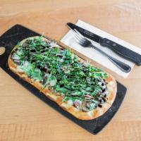 Arugula Flatbread · Sauteed mushrooms and onions topped with melted blue cheese crumbles, arugula and drizzled b...