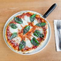 Margherita Pizza · Fresh mozzarella, tomato sauce, basil and Parmesan.