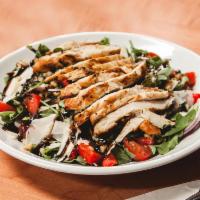 Grilled Chicken and Arugula Salad · Grape tomatoes, roasted peppers, red onions, toasted walnuts, shaved parmesan cheese and bal...