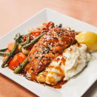 Pan Seared Salmon · Blackened or teriyaki glazed, served with mashed potatoes and vegetable du jour.