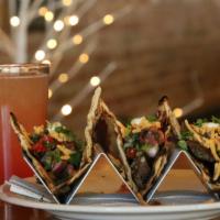 Naan Tacos · 3 tacos on naan bread. Pico de gallo, Mexican blended cheese, sour cream. Choice of pulled p...
