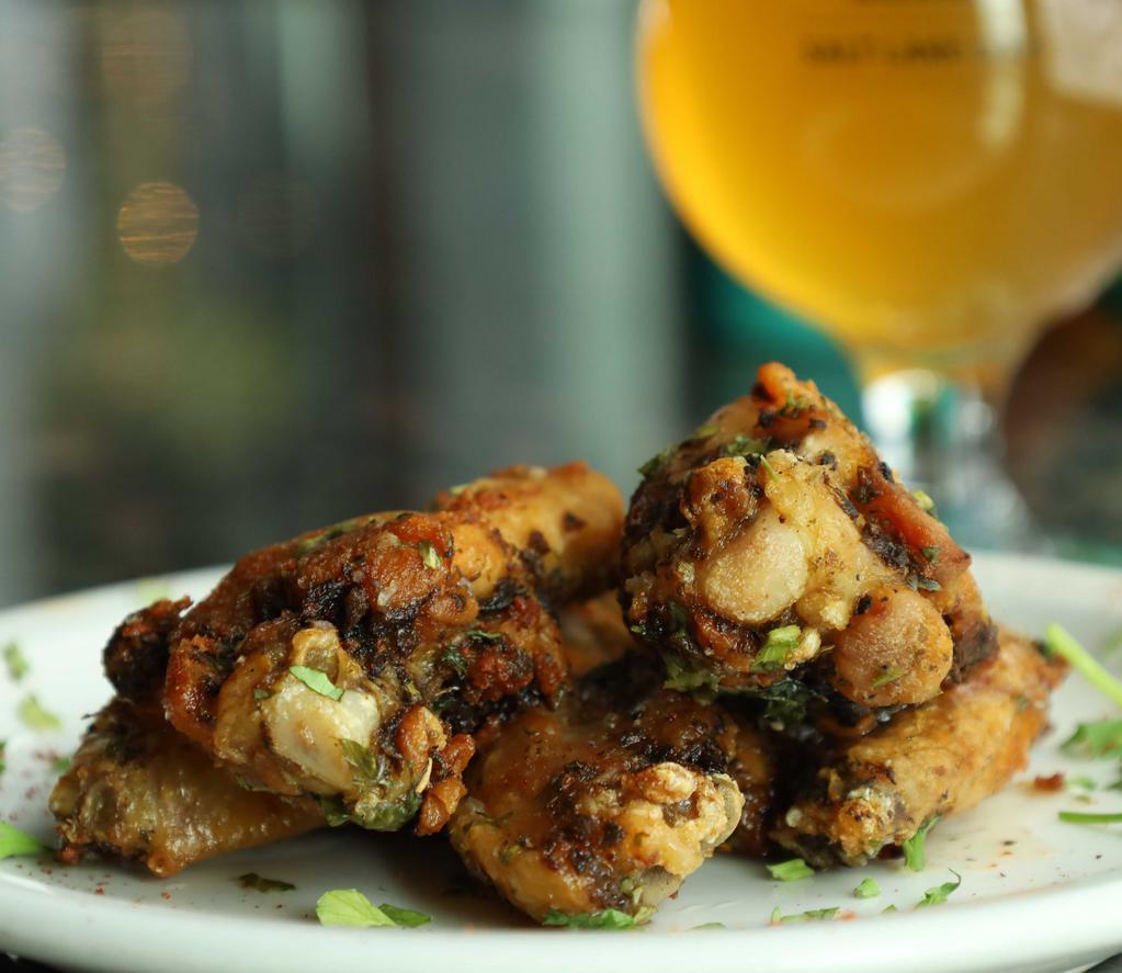 Chicken Wings · 6 wings seasoned with fine herbs, dipped in BBQ, Buffalo or garlic sauce.