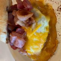 Breakfast Sandwich · Bacon or ham, cheese, fried or scrambled egg, served with our buttered bread