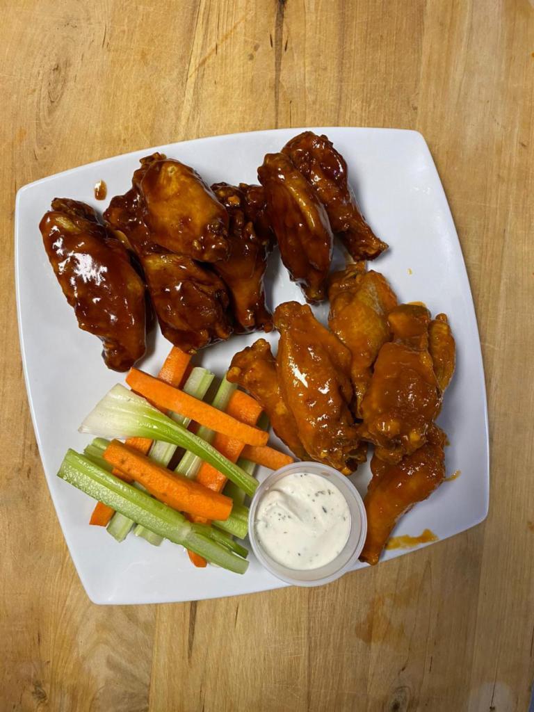 Wings · Jumbo party wings tossed in one of our signature sauces.  