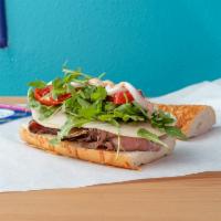 Waste Management Sandwich · Cold roast beef, provolone, arugula, Mama Lil's peppers, garlic sauce, chicpotle sauce.