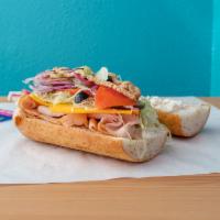 Bada Bing Club Sandwich · Turkey, ham, bacon, cheddar, lettuce, tomato, onion, pickles, pepperoncini, dijon mustard, m...