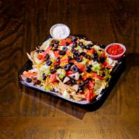 Loaded Nachos · Tortilla chips topped with cheddar cheese, tomatoes, lettuce, black olives, ground beef, sid...