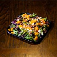 Balsamic Salad · Mixed wild greens, walnuts, oranges, feta and our house balsamic dressing.