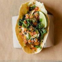 Baja Fish Taco · Battered Cod, flour tortilla, house sauce, pico, slaw, Mexican cheese, cilantro and mango ha...