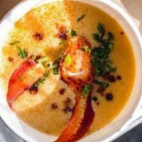 Lobster Bisque · Classic bisque, smoked bacon, chives, lobster chunks garnish.