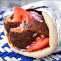 Falafel Sandwich · Falafel      Fried Chickpeas w/ Fresh herbs & Spices. Wrapped in a Toasted Pita w/Tomato...