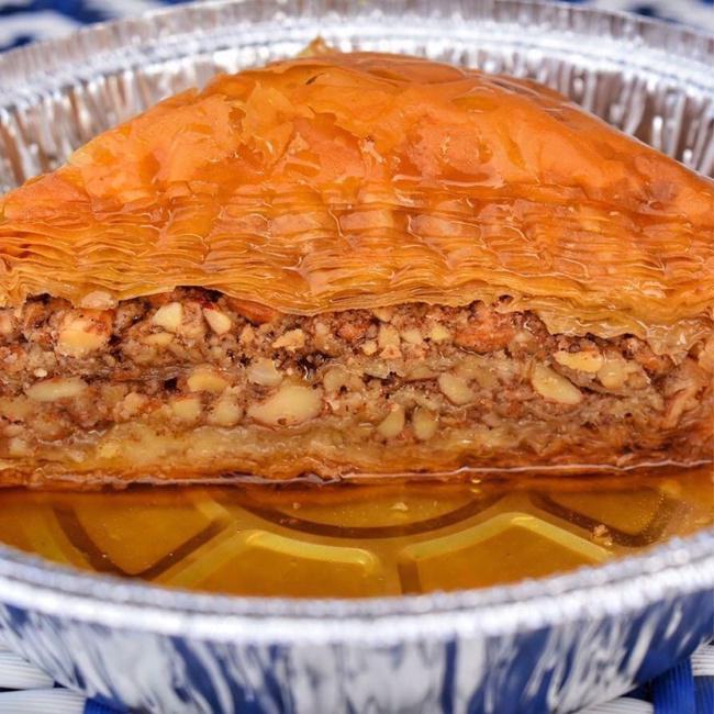 Baklava · Baklava is a pastry of phyllo (filo) dough and nuts. After the pastry is baked it is drenched with a syrup of honey and lemon juice.