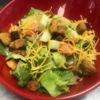 House Salad · Mixed greens, tomatoes, cucumbers, cheddar cheese and croutons.
