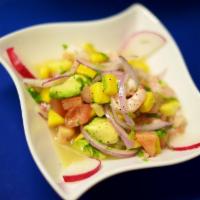 Ceviche Cancun · Baby Shrimp, mango, tomatoes, avocado, lime juice, olive oil, red onions and cilantro.