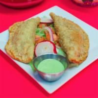 2 Empanadas · Pastry dough turn over filled with shredded chicken or shredded beef & a side of creamy jala...