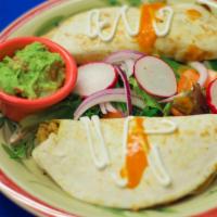 2 Quesadillas Mexico · Flour tortilla filled with mix cheese, sour cream and side of guacamole.