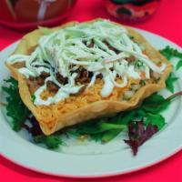 Taco Salad · Tortilla shell bowl, lettuce, pico de gallo, guacamole, rice and beans, sour cream and oaxac...