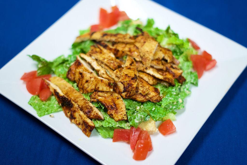 Grilled Chicken Caesar Salad · Romaine lettuce, croutons, Parmesan cheese and Caesar dressing.