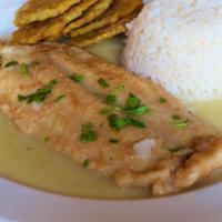 Pescado al Limon. · white fish filet in garlic sauce, served with white rice and tostones.