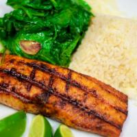 Salmon a la Parrilla · Grilled salmon filet, served with white rice and sautéed spinach. 