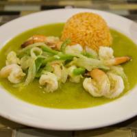 Camarones Mi Ranchito · Sauteed shrimps in red sauce, onions, and green peppers. Served with Mexican rice and beans.