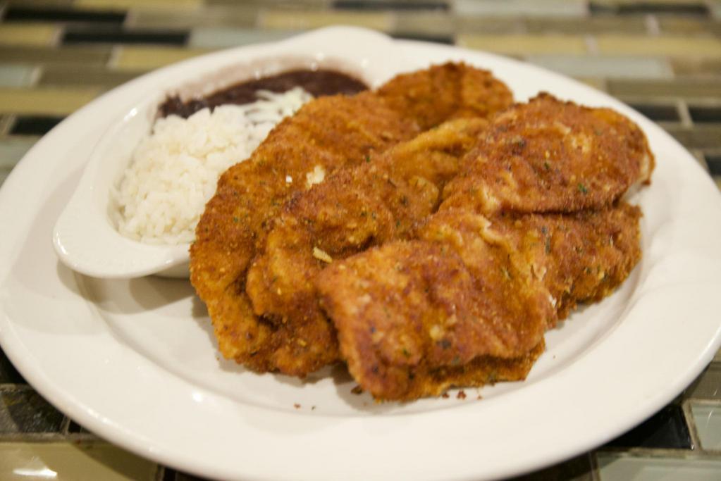 Pollo Empanizado · Breaded chicken breast served with white rice and beans.