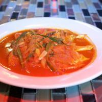 Pollo a la Mexicana · Chicken breast sauteed with red sauce, green peppers, and onions. Can be prepared spicy with...