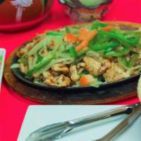 Fajitas Chicken · Sauteed onions and green peppers served with fresh pico de gallo, sour cream, guacamole, and...