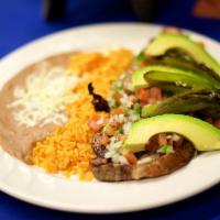 Bistec Rio Bravo · Grilled shell steak, topped with fresh pico de gallo, avocado slices, and grilled jalapeno o...
