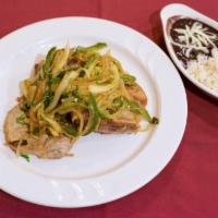 Chuletas Rancheras · Pork chops ,sauteed onions , Jalapeno's ,served with white rice and black beans