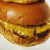 36. Cheeseburger · Patty topped with cooked mushrooms and swiss cheese. 
