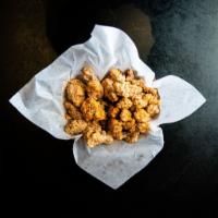 Popcorn Chicken · Flavorful marinated bite-sized chicken, perfectly fried and crisp. Spices are provided on th...