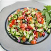 Kuchumber Salad · Chopped onions, tomatoes, cucumbers, green bell peppers, green onions, lettuce and cilantro ...