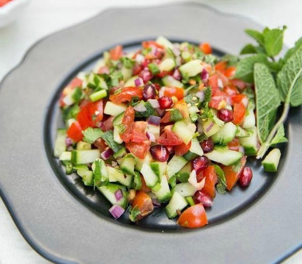 Kuchumber Salad · Chopped onions, tomatoes, cucumbers, green bell peppers, green onions, lettuce and cilantro mixed with chaat masala and lemon juice served with a lemon wedge. 
