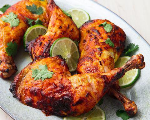 Tandoori Chicken · Spring chicken marinated in yogurt, garlic, ginger and ground spices cooked in a clay oven.