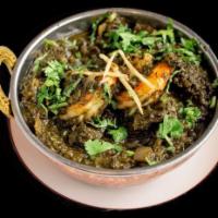 Prawn Saag · Fresh jumbo prawns sauteed with chopped garlic, onions and tomatoes mixed with cooked spinac...