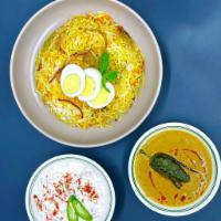  Dum Goat Biryani with Mirchi ka Salan · Long grain basmati rice cooked in a sealed pot layered with Goat and flavored with aromatic ...