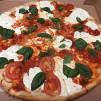 Margarita Pizza · Fresh tomato, fresh basil and fresh mozzarella.