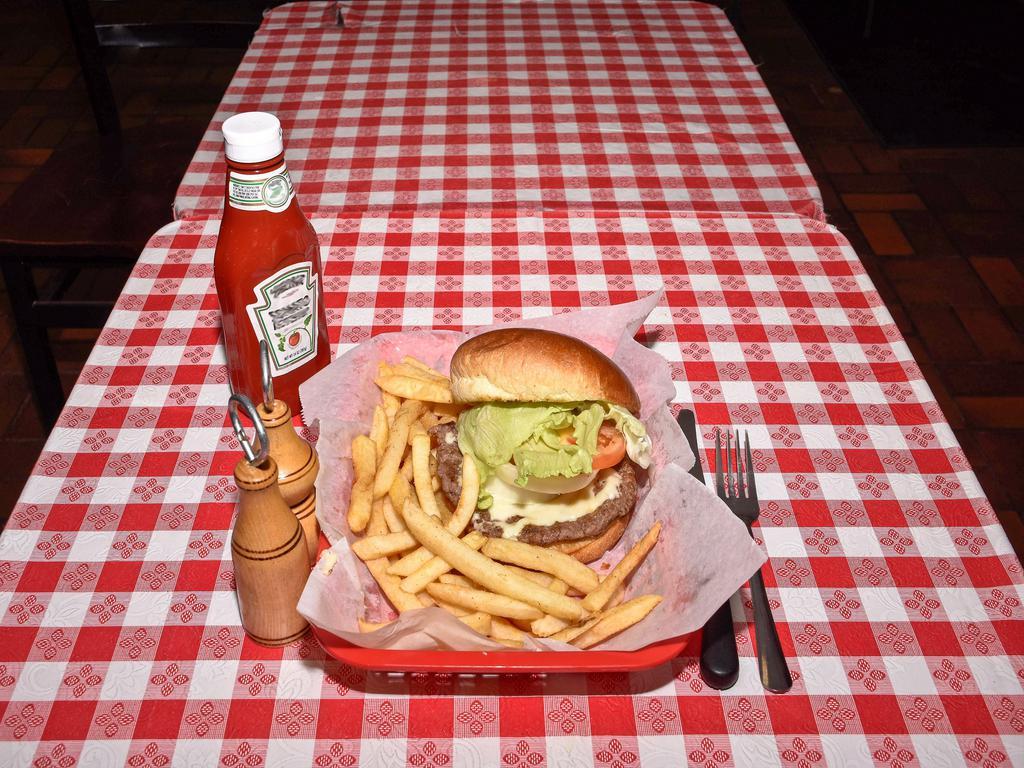 Cheeseburger Combo · Cheese, ketchup, mustard, lettuce, onions, and tomatoes. Served with french fries and soda.