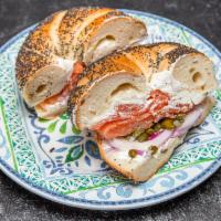 Cortelyou Lox · Homemade lox, cream cheese, capers, minced red onion, tomato and lemon on a bagel.