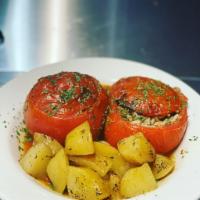 Yemista · Tomatoes stuffed with rice, herbs, and ground beef , crumbled feta, baked until juicy, and f...