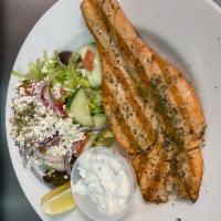 Salmon Fillet · Grilled with fresh herbs, served with a side salad.
